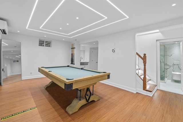 rec room featuring light hardwood / wood-style floors, sink, and billiards