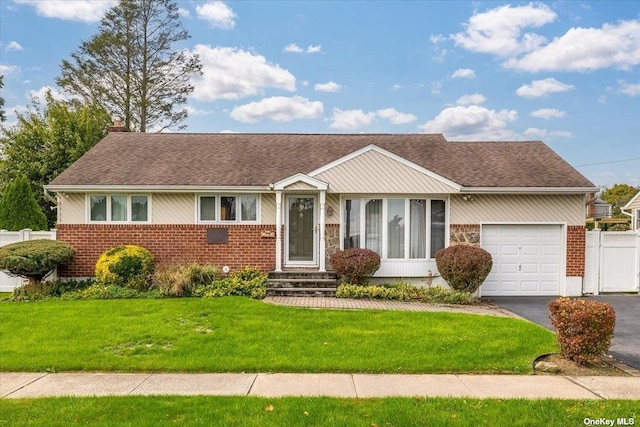 ranch-style house with a front lawn and a garage