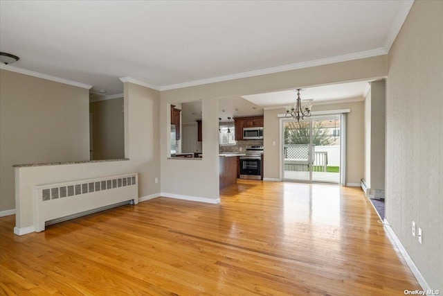 unfurnished living room with a notable chandelier, crown molding, light hardwood / wood-style flooring, and radiator heating unit