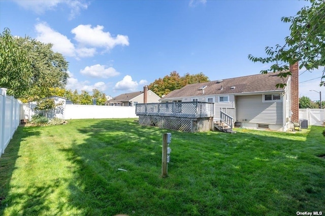 view of yard featuring a deck and cooling unit