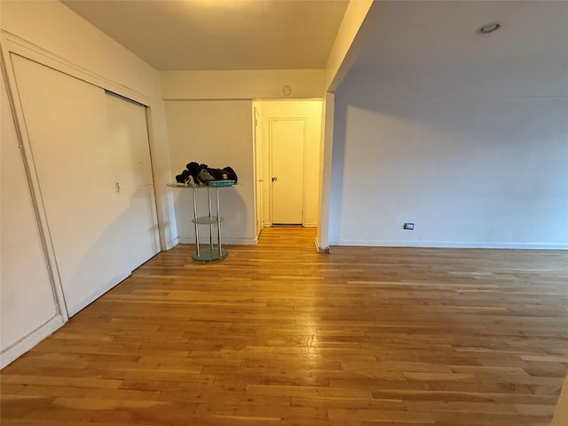 interior space with a closet and light hardwood / wood-style flooring