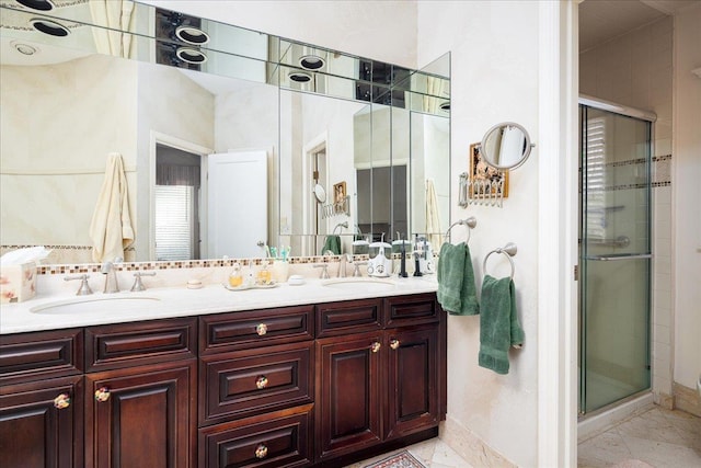 bathroom with vanity and an enclosed shower