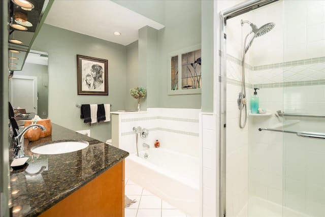 bathroom with tile patterned floors, plus walk in shower, and vanity