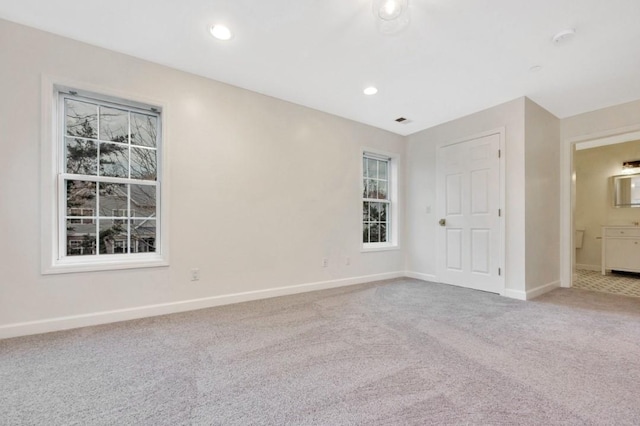 spare room featuring carpet floors