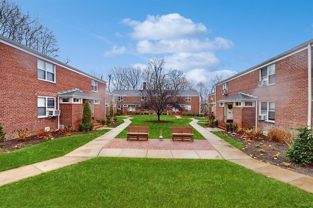 view of home's community with a yard