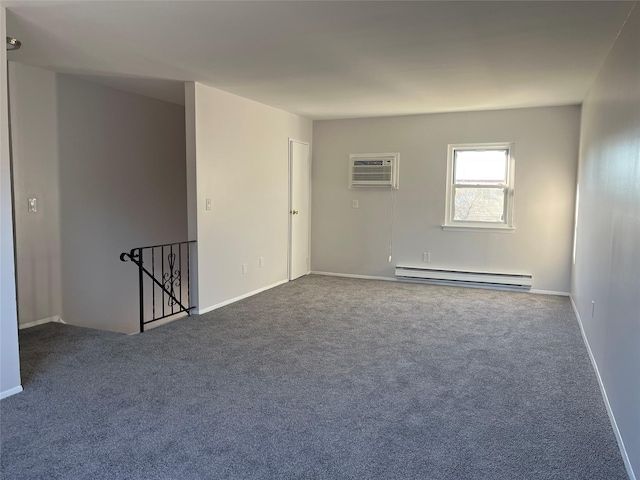 empty room featuring an AC wall unit, carpet floors, and a baseboard heating unit