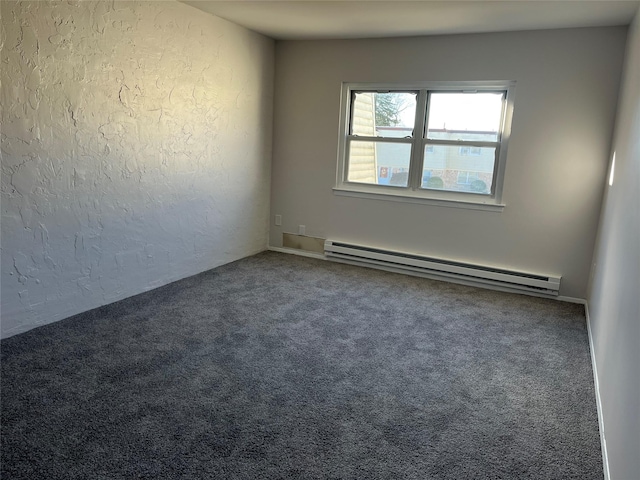 carpeted empty room featuring baseboard heating