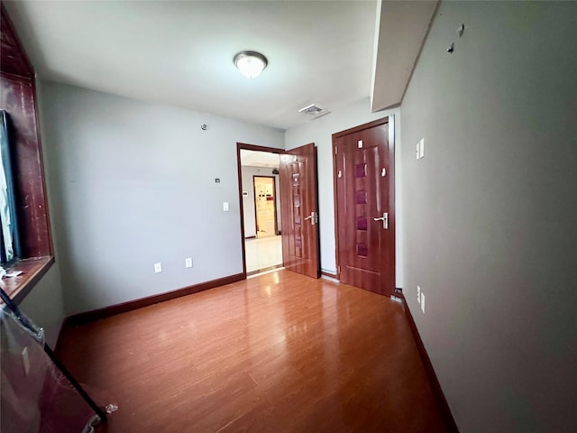 spare room featuring hardwood / wood-style flooring