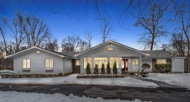 view of front of home with roof with shingles