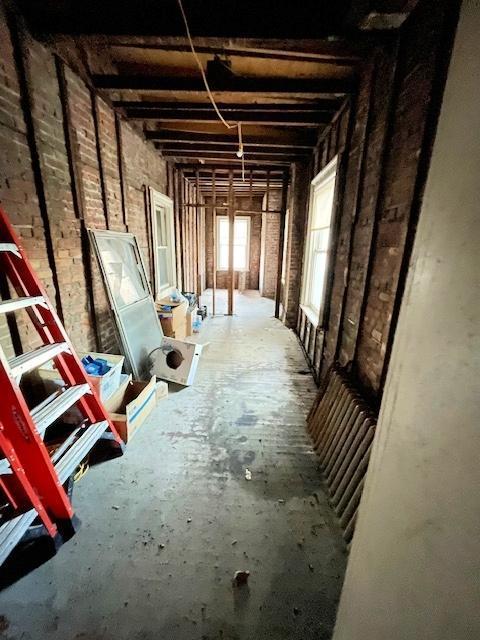 miscellaneous room with brick wall