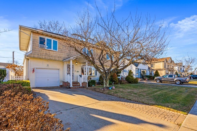 view of front property with a front yard and a garage