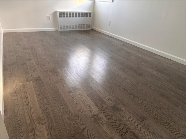 interior space with radiator and wood-type flooring