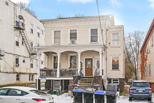 view of front of home with covered porch and cooling unit