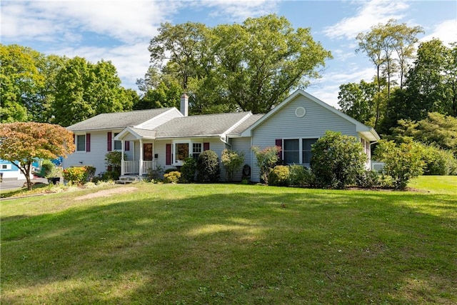 single story home featuring a front lawn