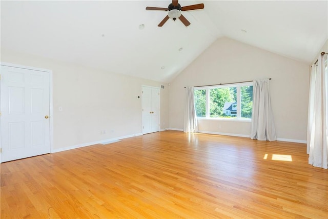 unfurnished room featuring light hardwood / wood-style floors, high vaulted ceiling, and ceiling fan