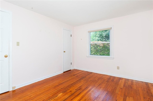 empty room featuring hardwood / wood-style floors