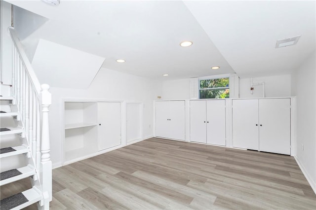 bonus room with light hardwood / wood-style floors