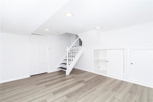 basement featuring light hardwood / wood-style floors