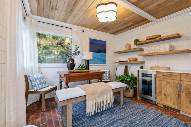 living area featuring wine cooler, wood ceiling, and wooden walls