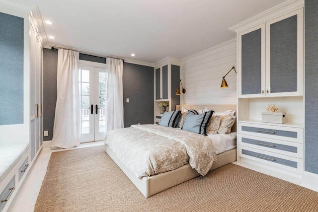 bedroom featuring access to outside, crown molding, and french doors