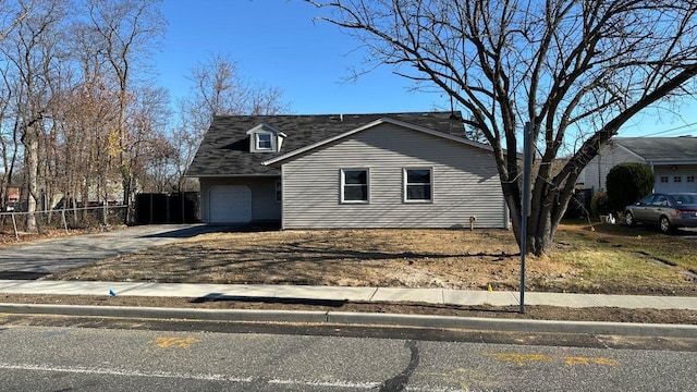 front of property with a garage