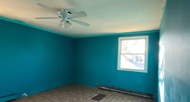 empty room featuring baseboard heating and ceiling fan