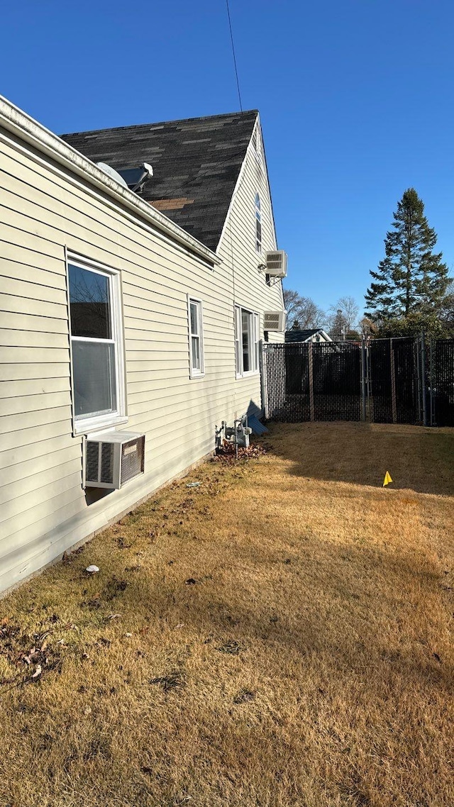 view of property exterior with a lawn