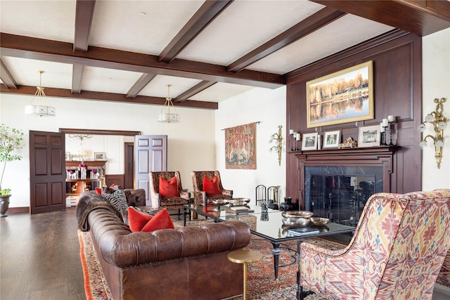 living room with a fireplace, hardwood / wood-style floors, and beamed ceiling