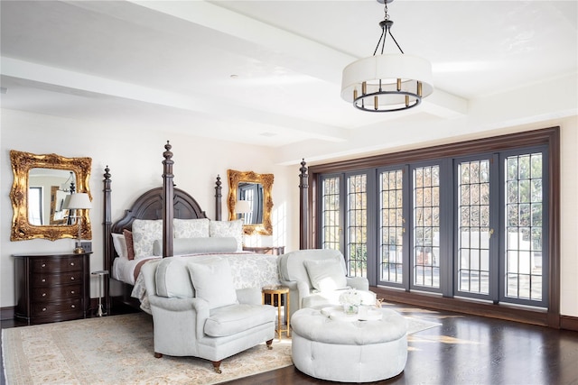 bedroom featuring beamed ceiling and dark hardwood / wood-style floors