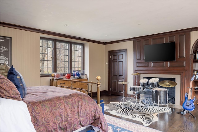 bedroom featuring wood-type flooring and ornamental molding