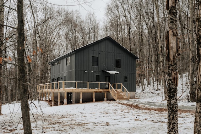 snow covered property featuring a deck