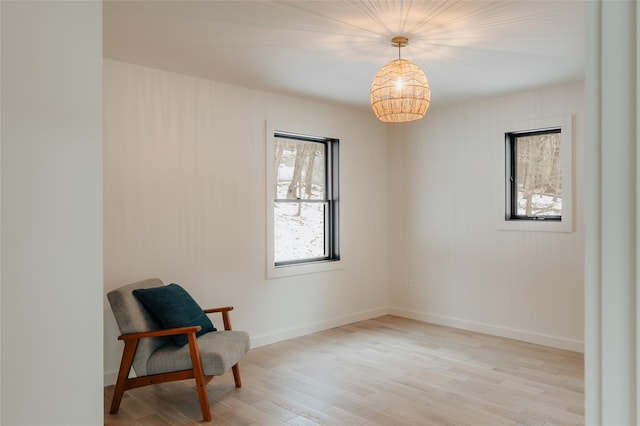 sitting room with light hardwood / wood-style floors