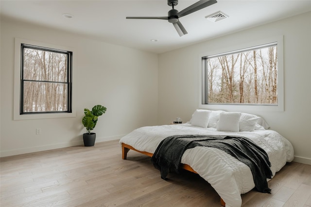 bedroom featuring ceiling fan and light hardwood / wood-style flooring