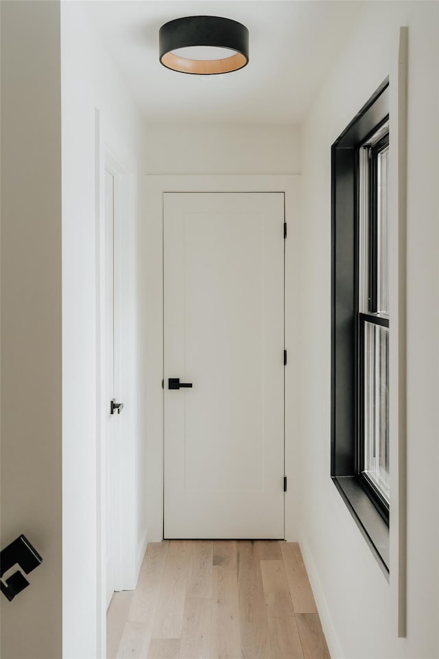 hallway featuring light wood-type flooring