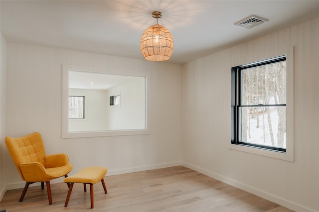 sitting room with light hardwood / wood-style floors