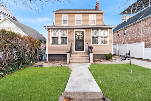 view of front of home with a front yard