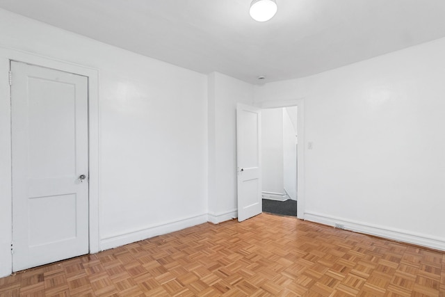 spare room with light parquet flooring