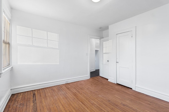 empty room featuring hardwood / wood-style flooring