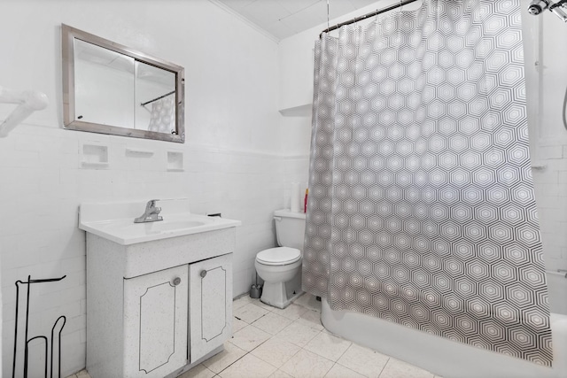 full bathroom featuring vanity, shower / bath combo, tile patterned flooring, toilet, and tile walls