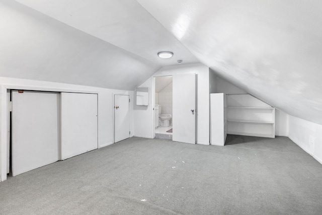 bonus room with vaulted ceiling