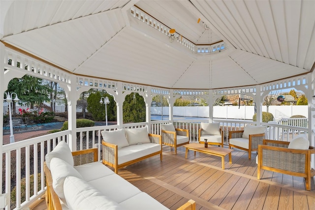 wooden terrace with a gazebo and an outdoor hangout area