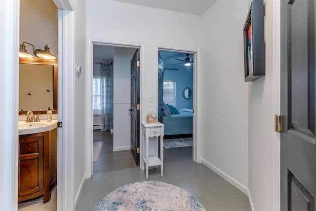 bathroom with vanity, hardwood / wood-style flooring, and ceiling fan