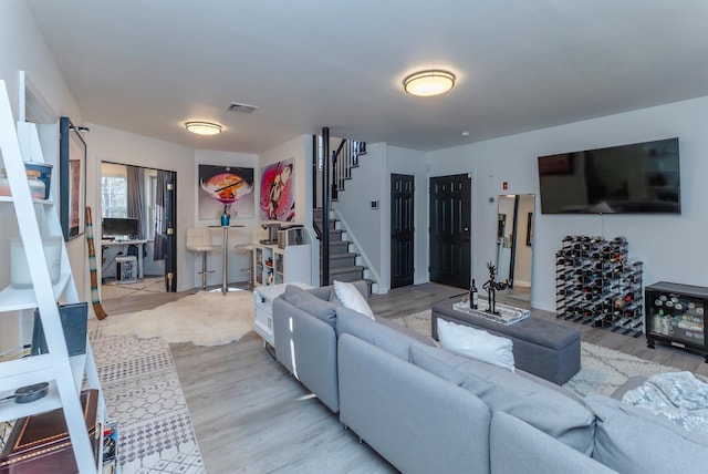 living room with light hardwood / wood-style flooring