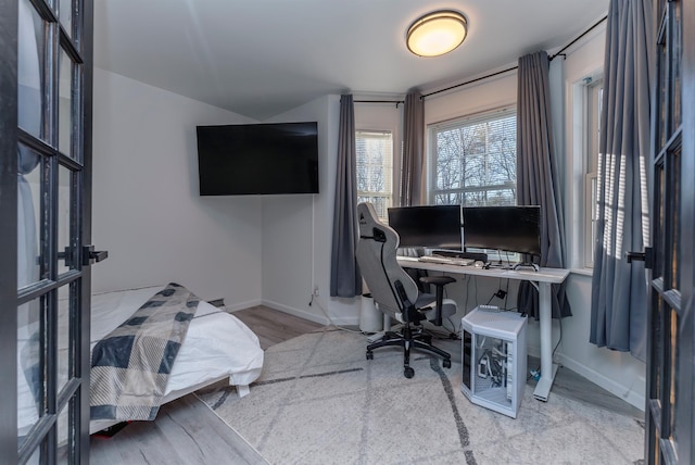 office space with wood-type flooring