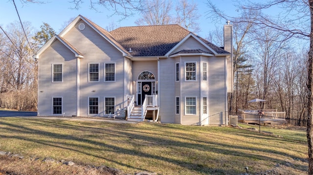 raised ranch with a front yard