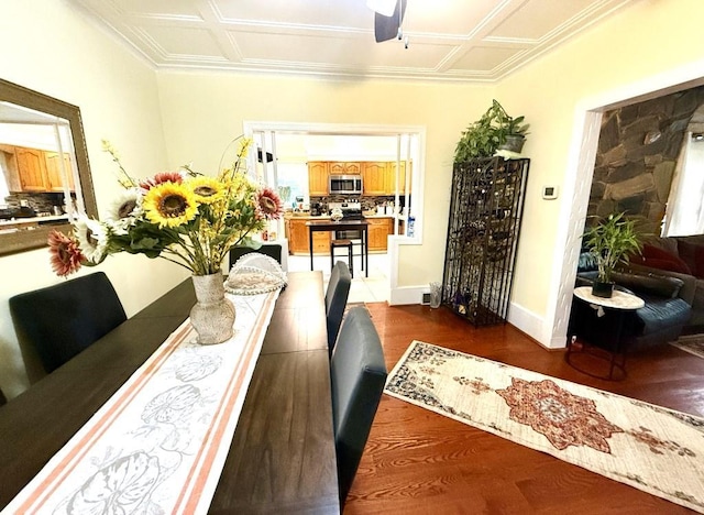 dining room with ceiling fan and dark hardwood / wood-style flooring