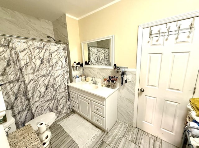 bathroom featuring vanity, crown molding, toilet, tile walls, and a shower with curtain