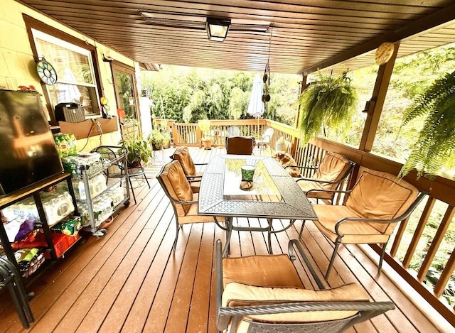 deck with outdoor dining area