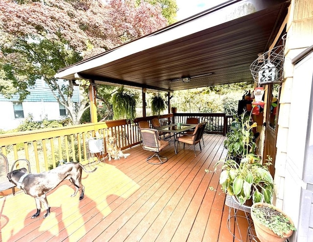 deck with outdoor dining space