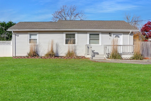 ranch-style house with a front lawn